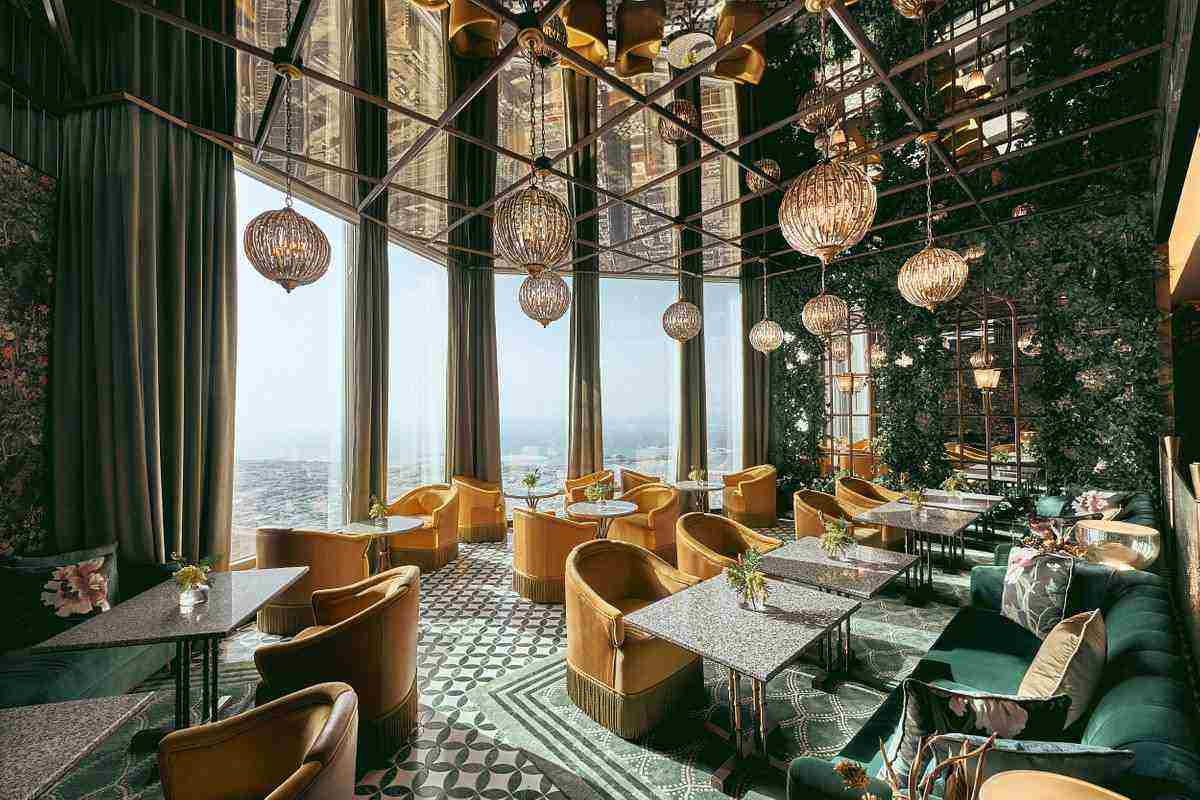 Where is the entrance to the Atmosphere restaurant?